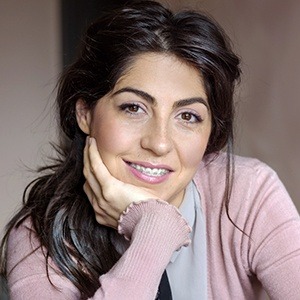 Woman smiling with traditional orthodontics